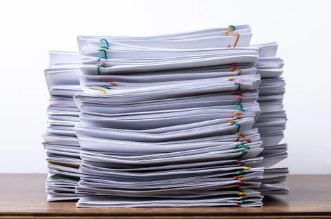 Stack overload document report paper with colorful paperclip place and copy s Stock Photos