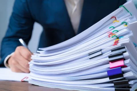 Stack overload document report papers, business paperless concept. Stock Photos