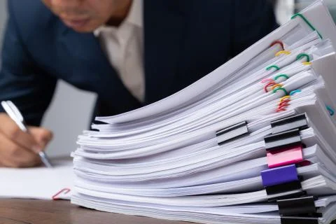 Stack overload document report papers, business paperless concept. Stock Photos