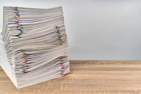 Stack overload paperwork report on wooden table with copy space Stock Photos
