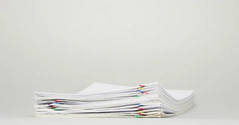 Stack overload receipt and report on white table time lapse Stock Footage 61931841