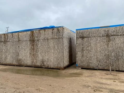 Stack of Package Boxes on Wooden Pallets. Interior of Storage Warehouse. Card Stock Photos