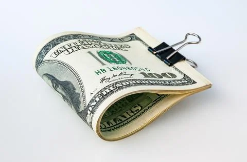 A stack of packaged dollars on a white background. One hundred American dolla Foto stock