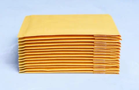 Stack of Padded Envelopes on Grey Background Foto stock