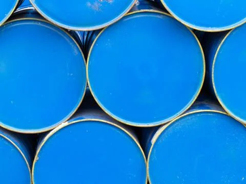 Stack of painted blue oil barrels Stock Photos