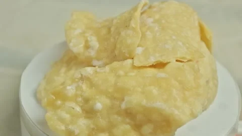 Stack of pale yellow sweet crackers with crunchy texture rotating on a whit.. Stock Footage 323572057