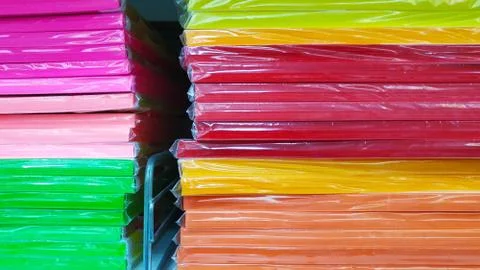 Stack of palette of colored paper for needlework on a shelf in a store close-up Stock-Fotos