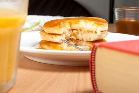 Stack of pancakes and syrup on a breakfast table Stock Photos