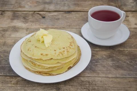 A stack of pancakes and tea. Breakfast at my grandmother's. Stock Photos