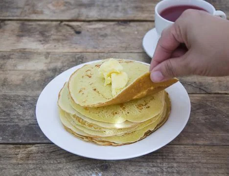 A stack of pancakes and tea. Breakfast at my grandmother's. Stock Photos