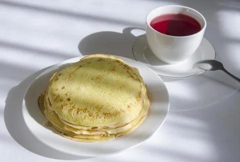 A stack of pancakes and tea. Breakfast at my grandmother's. Stock Photos