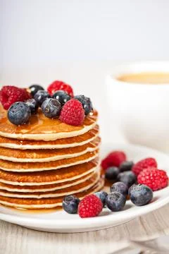 Stack of pancakes with berries breakfast Stock Photos