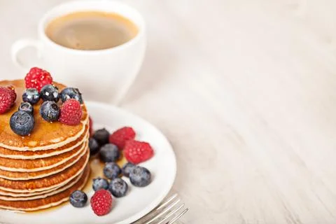 Stack of pancakes with berries breakfast Stock Photos