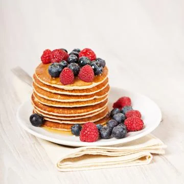Stack of pancakes with berries breakfast Stock Photos
