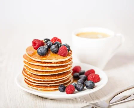 Stack of pancakes with berries breakfast Stock Photos