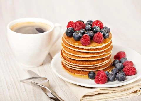 Stack of pancakes with berries breakfast Stock Photos