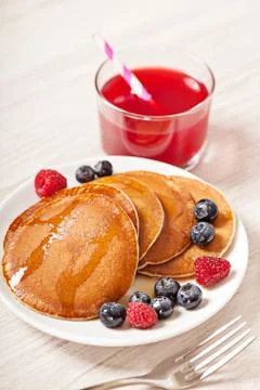 Stack of pancakes with berries breakfast Stock Photos