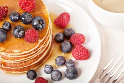 Stack of pancakes with berries breakfast Stock Photos