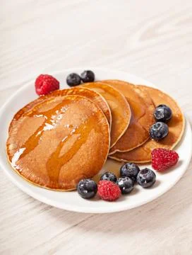 Stack of pancakes with berries breakfast Stock Photos