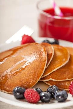 Stack of pancakes with berries breakfast Stock Photos