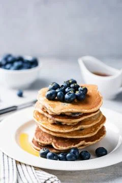 Stack of pancakes with blueberries and maple syrup 스톡 사진