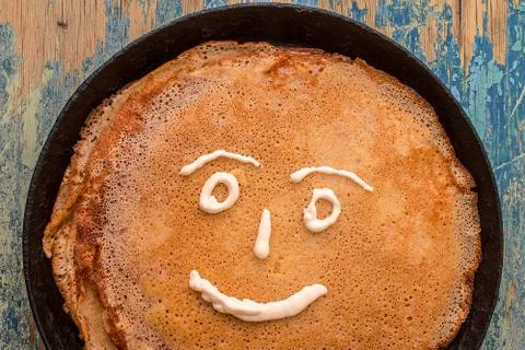 Stack of pancakes on a cast-iron frying pan. Stock Photos