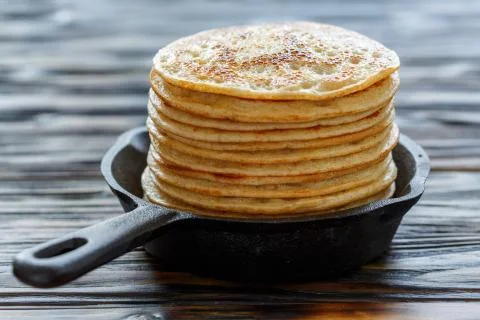 Stack of pancakes in a cast iron pan. Stock Photos