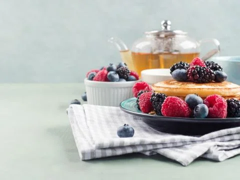 Stack of pancakes with colorful berries Stock-Fotos