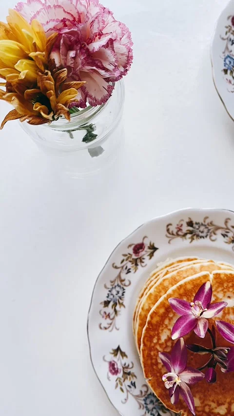 Stack of pancakes with flowers, yummy pancakes, Stock Footage 227406961