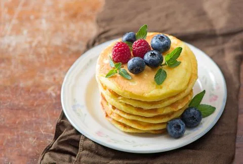 Stack of pancakes with fresh berries, close-up. Stock Photos