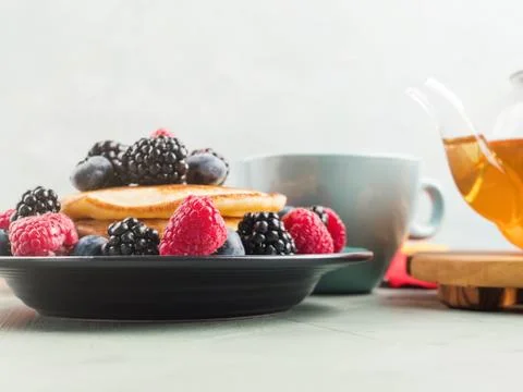 Stack of pancakes with fresh berries Stock Photos