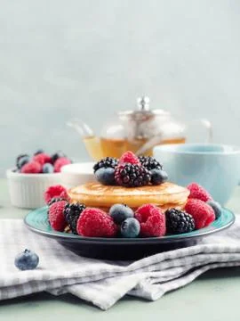 Stack of pancakes with fresh berries Stock Photos