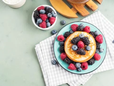 Stack of pancakes with fresh berries Stock Photos
