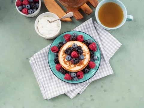 Stack of pancakes with fresh berries Stock Photos