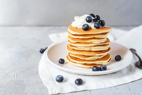 Stack of pancakes with fresh blueberry. Stock Photos
