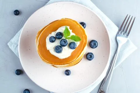 Stack of pancakes with fresh blueberry. Stock Photos