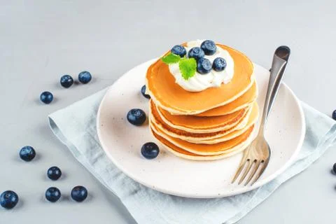 Stack of pancakes with fresh blueberry. Stock Photos
