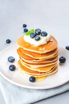 Stack of pancakes with fresh blueberry. Stock Photos