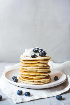 Stack of pancakes with fresh blueberry. Stock Photos