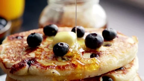 Stack of Pancakes with Melting Butter. adds maple syrup to pancakes in kitchen. Stock-Footage 336589082