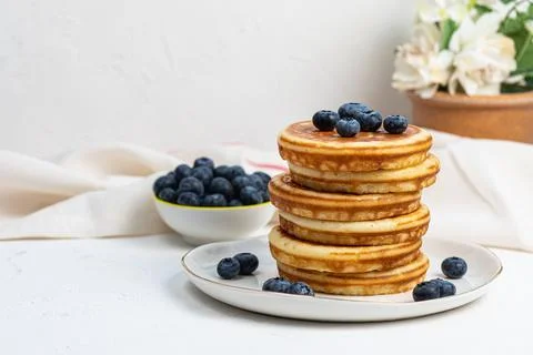 Stack of pancakes on plate with blueberries, front view Stock Photos