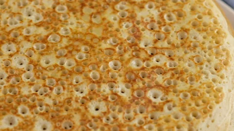 A stack of pancakes is on a plate. Camera movement. Big round pancake. Cooking Video stock 145489888