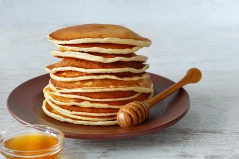 Stack of pancakes in a plate on the table Stock Photos