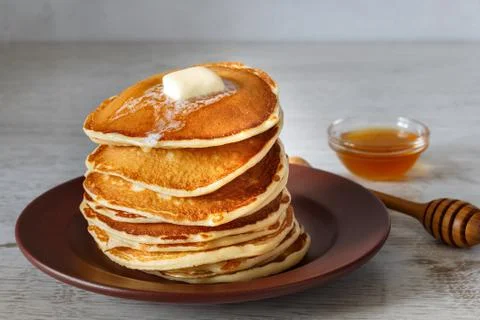 Stack of pancakes in a plate on the table Stock Photos