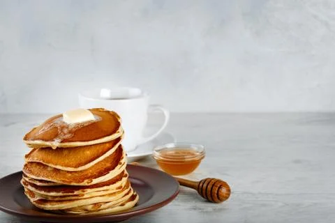 Stack of pancakes in a plate on the table Stock Photos