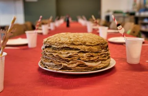 Stack of pancakes on a red tablecloth Stock Photos