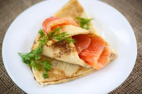 Stack of pancakes with salted salmon Foto stock