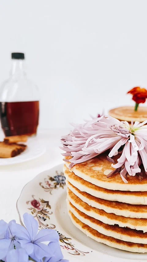 Stack of pancakes, stack of pancakes with flower on top, purple flower Stock Footage 227403636
