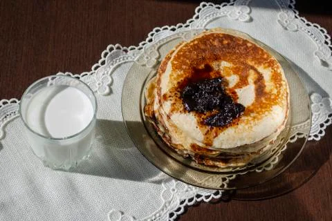 Stack of pancakes topped with cherry jam Stock Photos