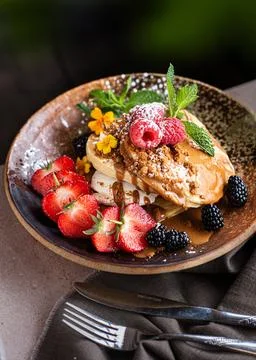 Stack of Pancakes with Whipped Cream and Fresh Berries. Stock Photos